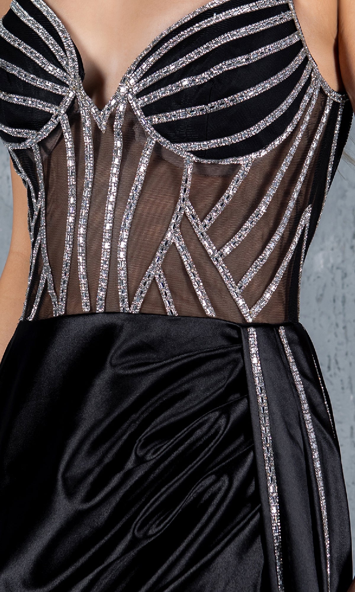 The Side-Sash Long Prom Gown: Cinderella Couture 8219J is a black plus size formal dress featuring sheer mesh panels and geometric silver sequins on the bodice, ideal for elegant occasions.